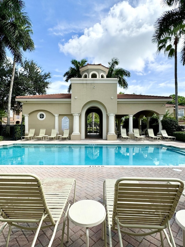 view of swimming pool with a patio area