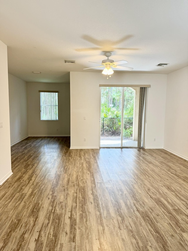 empty room featuring ceiling fan and hardwood / wood-style flooring