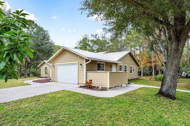 view of front of property with a front lawn and a garage