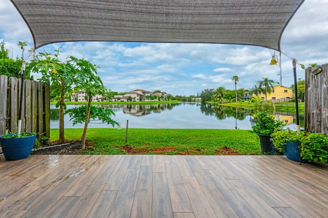 wooden deck with a water view