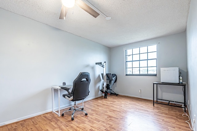 office with ceiling fan, a textured ceiling, and light hardwood / wood-style floors