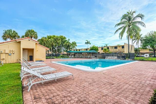 view of swimming pool with a patio