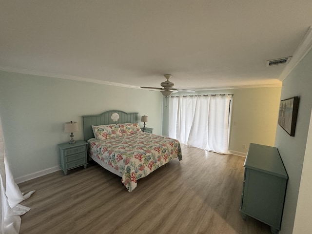 bedroom featuring crown molding, ceiling fan, and hardwood / wood-style flooring