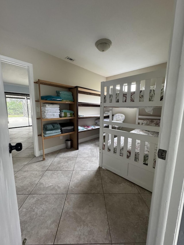 bedroom with tile patterned floors