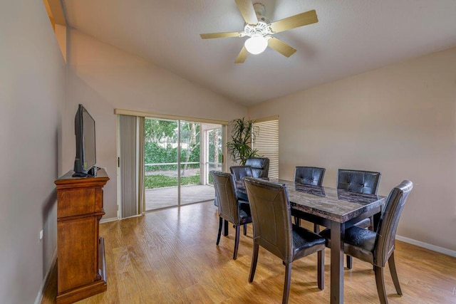 dining room with vaulted ceiling, light hardwood / wood-style floors, and ceiling fan