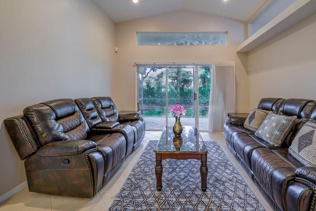 living room featuring lofted ceiling and light tile patterned floors