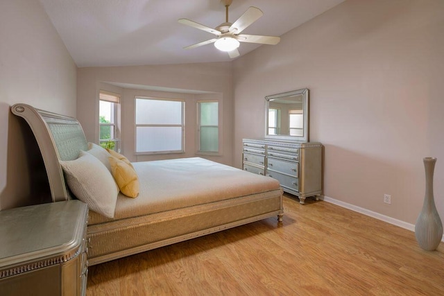 bedroom featuring lofted ceiling, light wood-type flooring, and ceiling fan