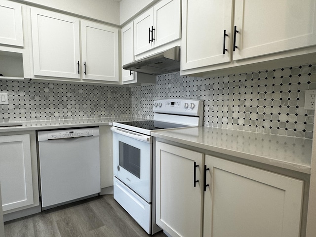 kitchen featuring white cabinetry, backsplash, white appliances, and dark wood-type flooring