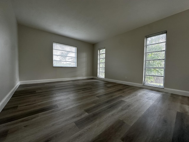 empty room featuring dark wood-type flooring