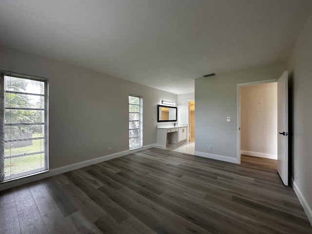 spare room featuring dark hardwood / wood-style floors