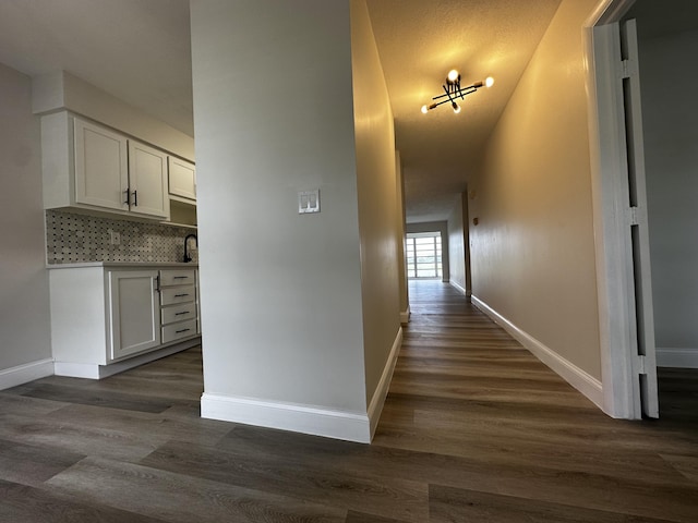 hall with dark hardwood / wood-style floors