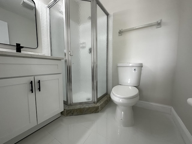 bathroom with toilet, walk in shower, vanity, and tile patterned flooring