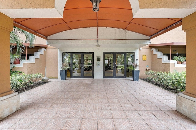 view of exterior entry featuring french doors