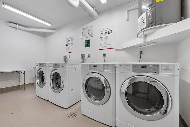 clothes washing area with washing machine and clothes dryer