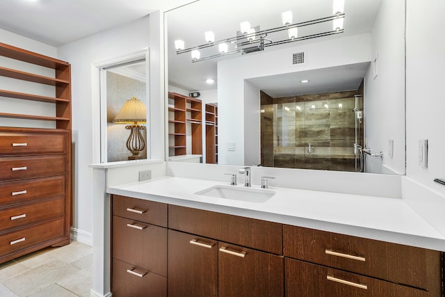 bathroom featuring walk in shower and vanity