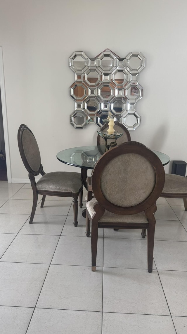 dining area with light tile patterned floors