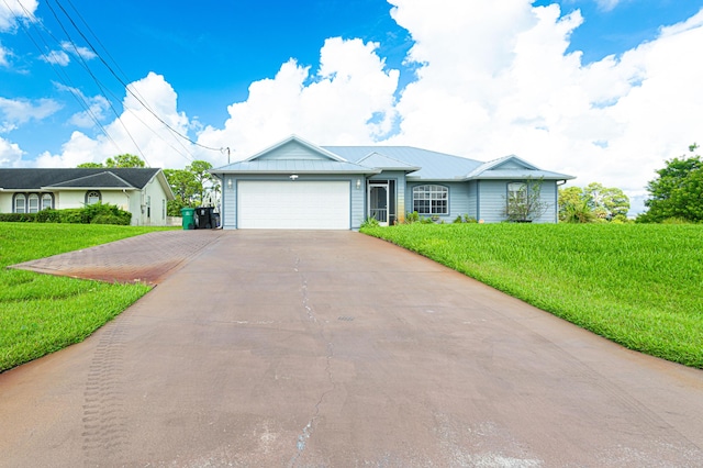 ranch-style house featuring a garage and a front lawn