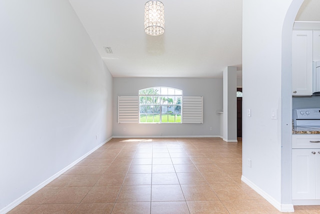 interior space with a chandelier and light tile patterned floors