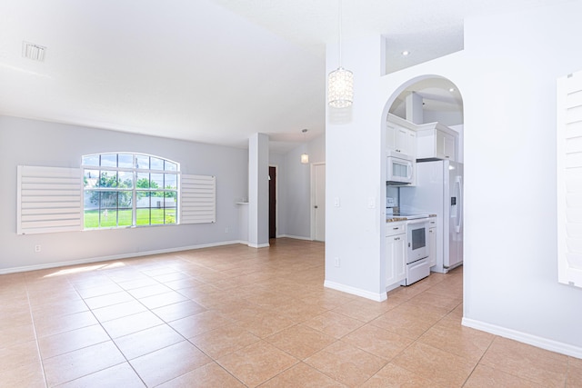 unfurnished living room featuring light tile patterned floors