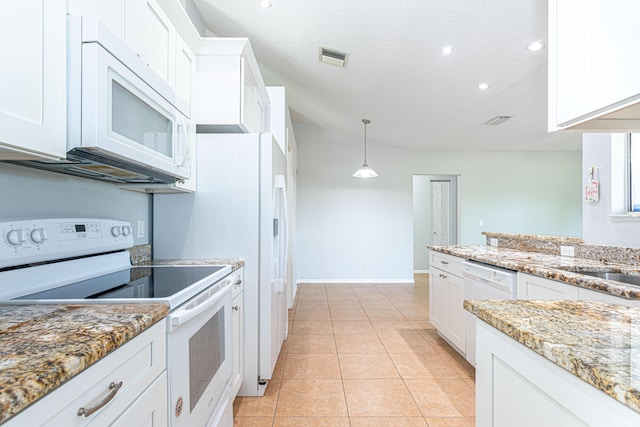 kitchen with light tile patterned flooring, light stone counters, pendant lighting, white appliances, and white cabinets