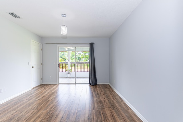 spare room featuring dark hardwood / wood-style flooring