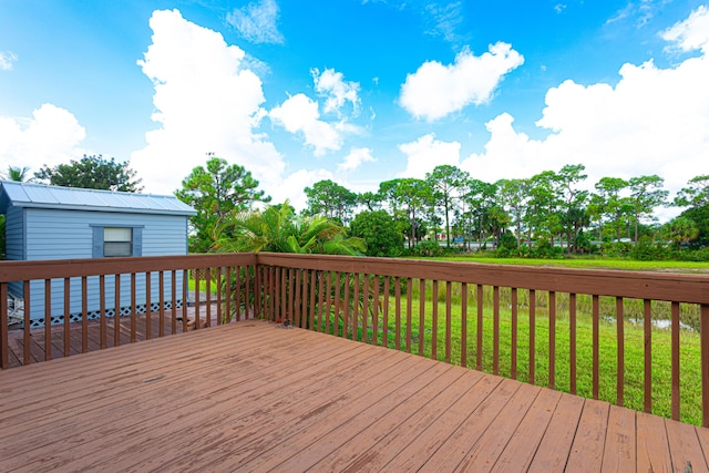 wooden deck with a yard