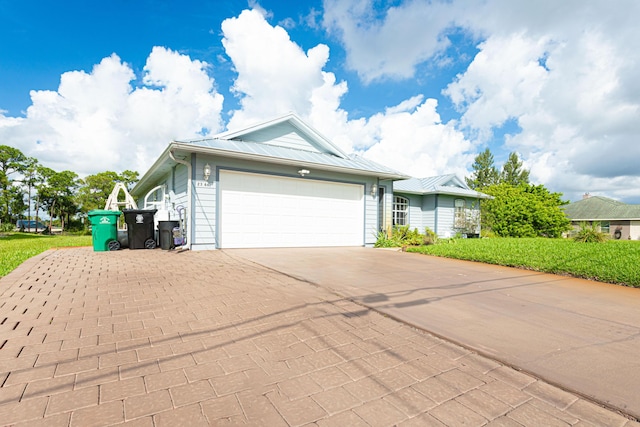 view of front of home with a garage