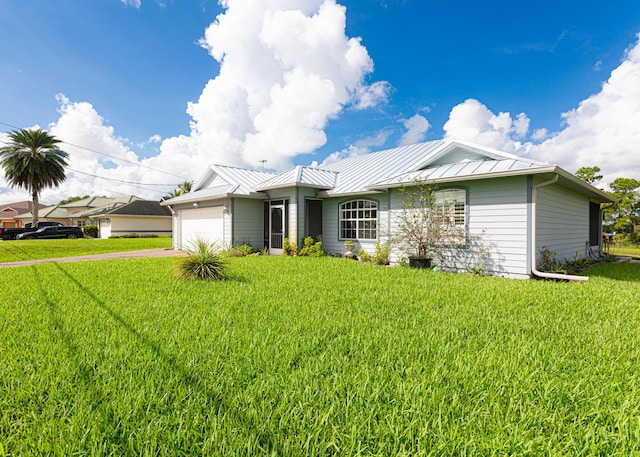 single story home with a garage and a front lawn