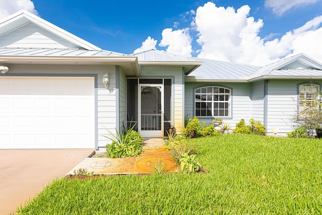 ranch-style house with a garage and a front yard