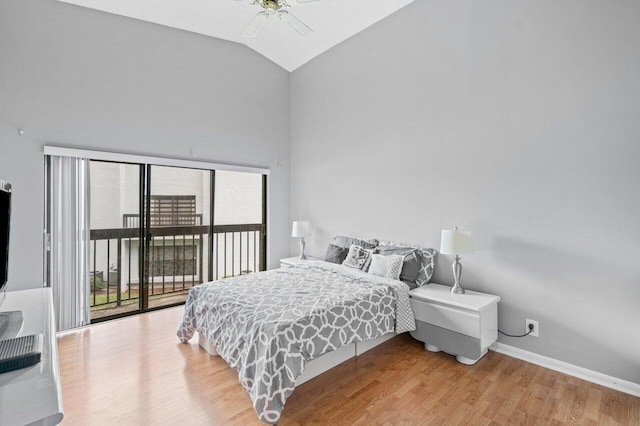 bedroom featuring ceiling fan, lofted ceiling, hardwood / wood-style floors, and access to outside