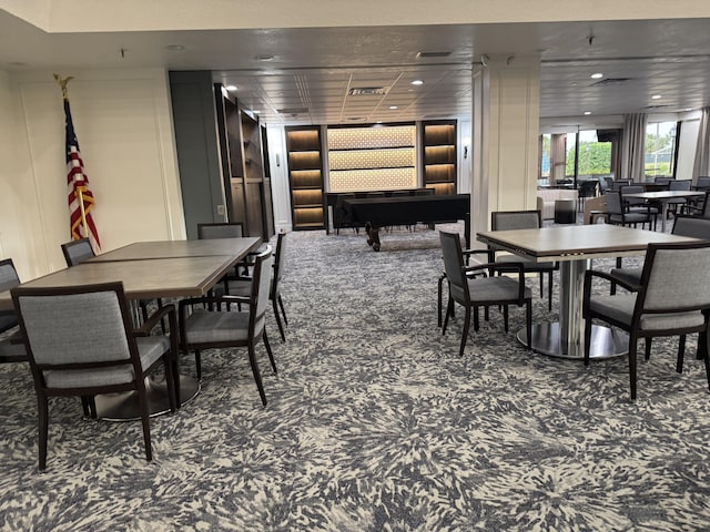 dining area with carpet flooring and built in features