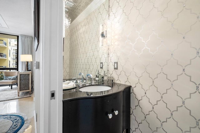 bathroom with vanity and expansive windows