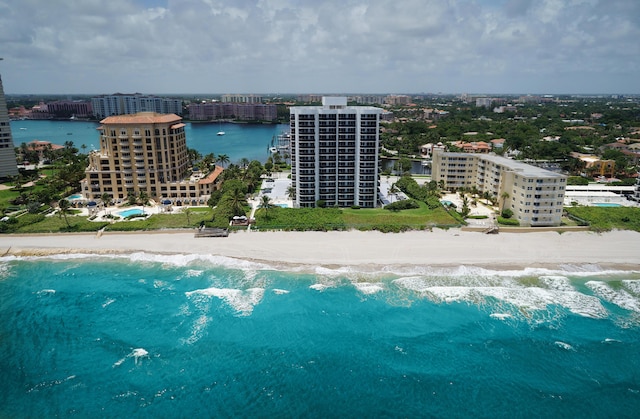 aerial view with a water view and a beach view