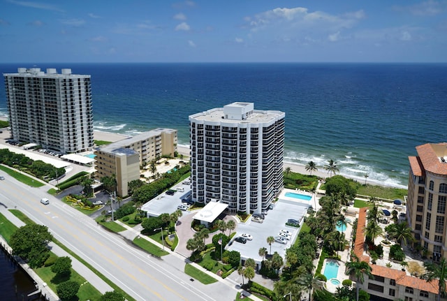 bird's eye view featuring a beach view and a water view