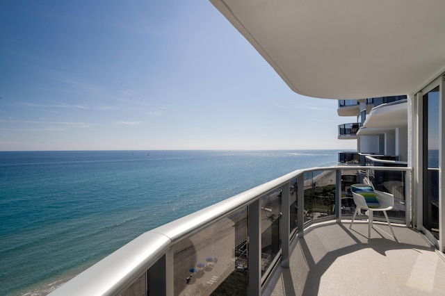 balcony featuring a water view