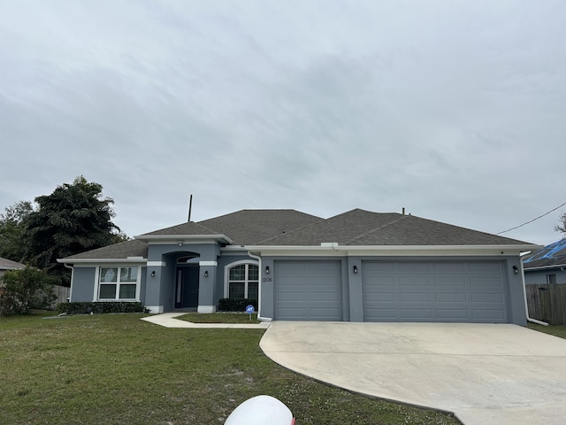 ranch-style house with a front yard and a garage