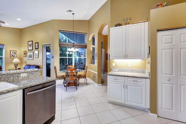 kitchen featuring decorative light fixtures, stainless steel dishwasher, white cabinetry, and light tile patterned floors