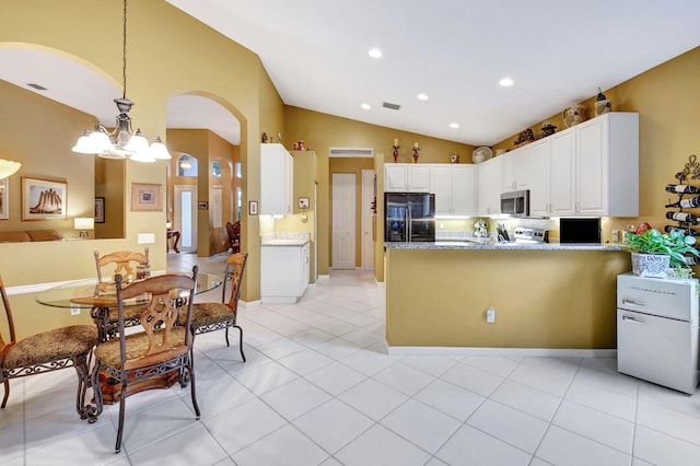 kitchen featuring white cabinetry, light tile patterned floors, pendant lighting, black fridge with ice dispenser, and lofted ceiling