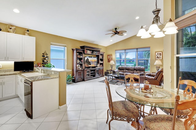 kitchen featuring dishwasher, white cabinets, sink, kitchen peninsula, and pendant lighting