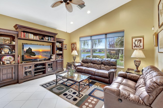 tiled living room with ceiling fan and lofted ceiling