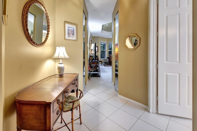 hall featuring light tile patterned floors