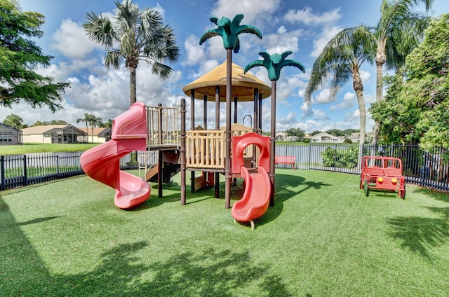 view of playground featuring a lawn