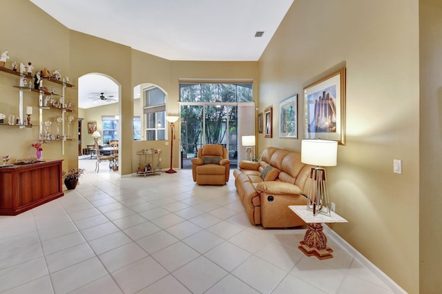 living room featuring lofted ceiling and light tile patterned flooring