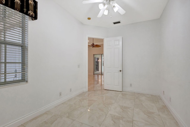 unfurnished room with ceiling fan