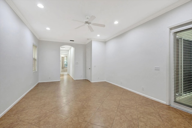 tiled spare room with ceiling fan and ornamental molding