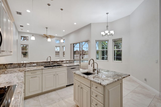 kitchen featuring decorative light fixtures, sink, stainless steel dishwasher, and black electric stovetop