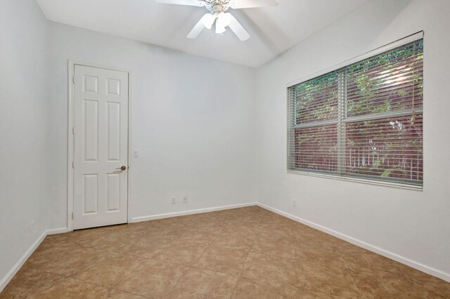 unfurnished room featuring ceiling fan and light tile patterned flooring