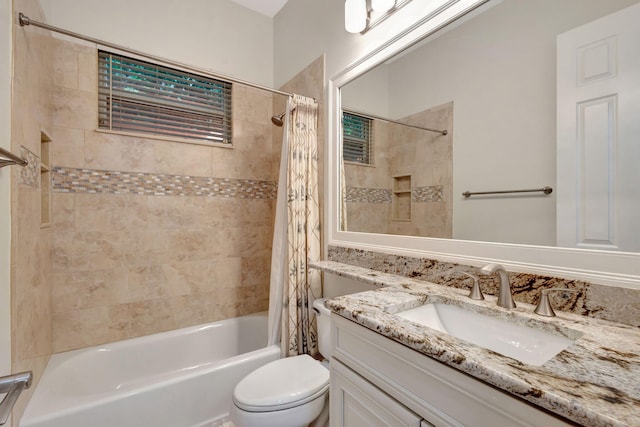 full bathroom featuring toilet, shower / tub combo, and vanity