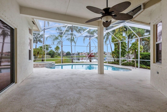 view of swimming pool with a patio area, a lanai, an in ground hot tub, and a water view