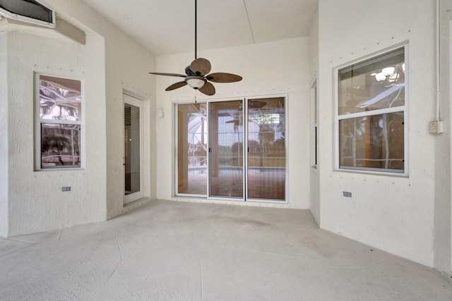 interior space with ceiling fan